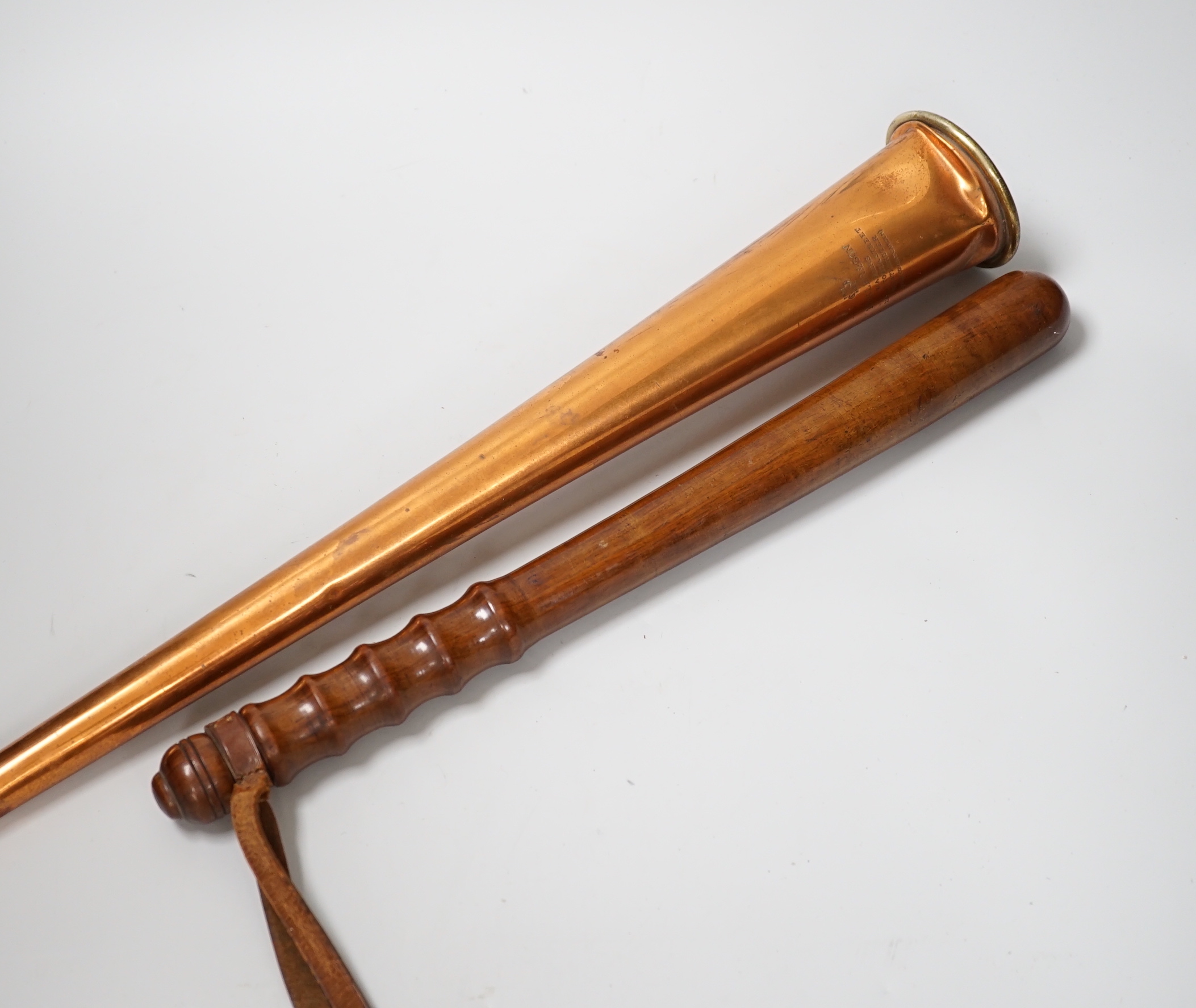 A copper hunting horn by Kohler & Son, a.f., in leather case and a turned wood truncheon, the largest 88cm in length
